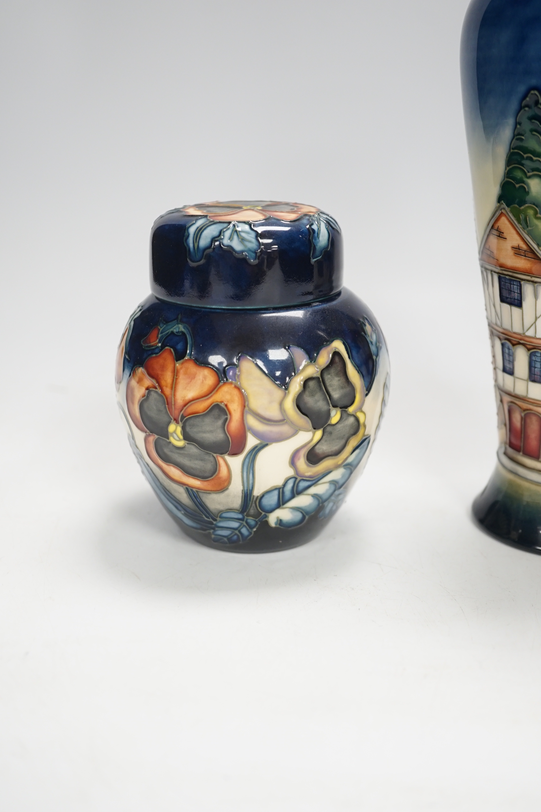 A Moorcroft Pansy ginger jar by Sally Guy, limited edition 18/100 and a Moorcroft ‘Thaxted’ limited edition vase by Philip Gibson, 123/200, largest 20cm high